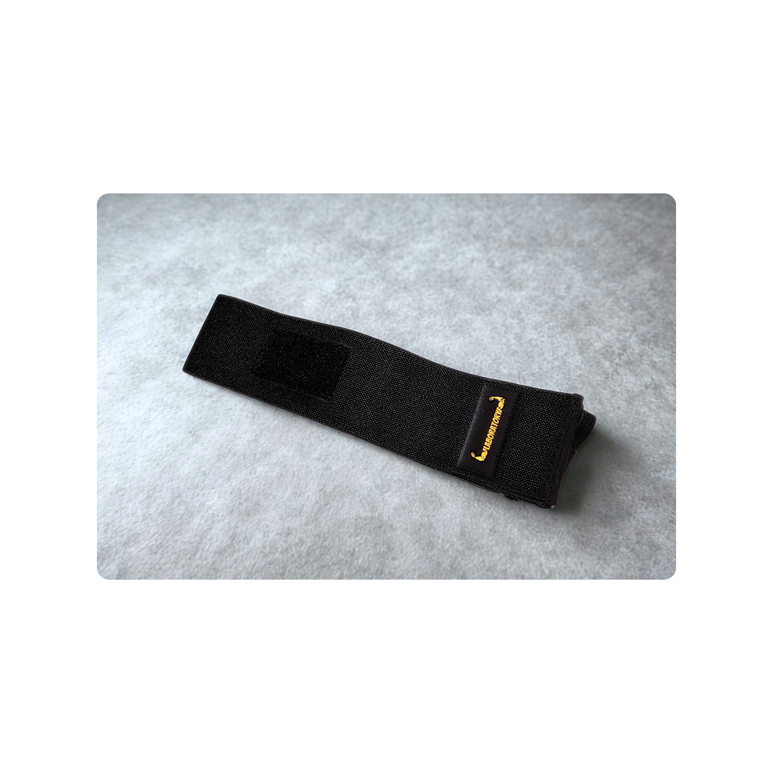 BLACK LABORATORY ELBOW WRAPS ON GRAY BACKGROUND