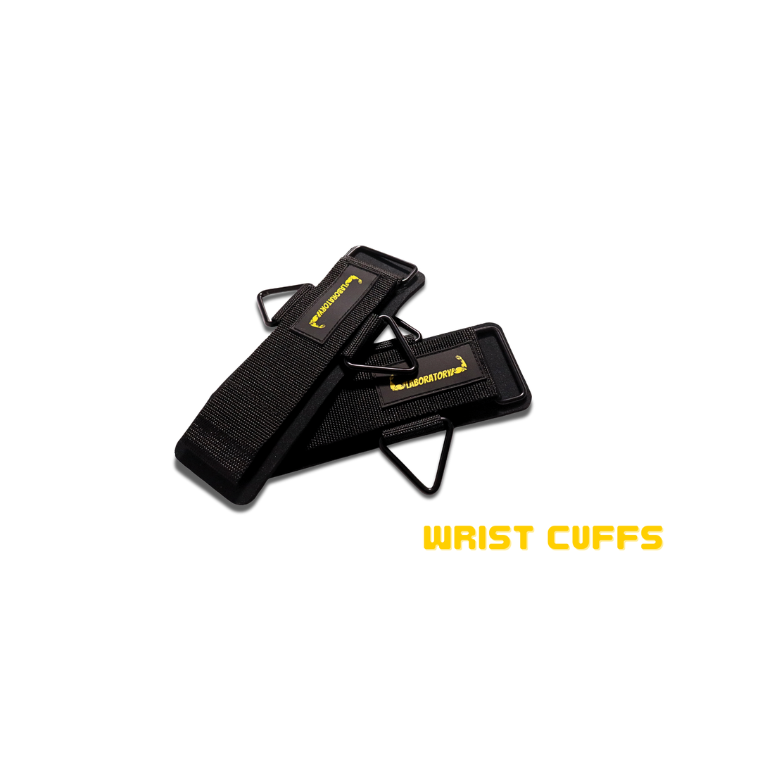 Black wrist cuffs with yellow text on a white background