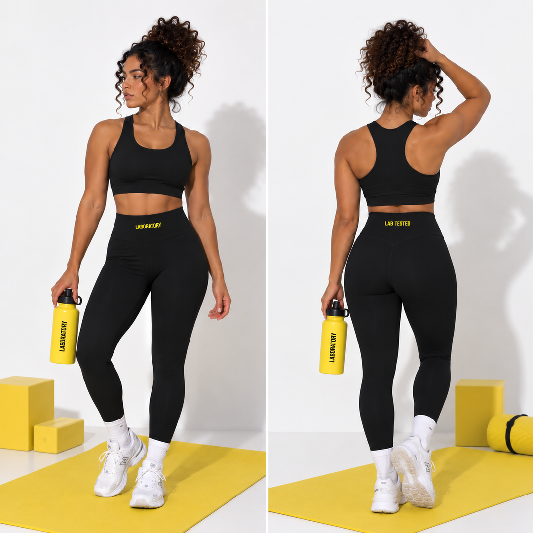 A woman modeling a black sports bra and high-waisted black leggings set with a yellow logo belt, shown in front and back views on a white studio background with yellow props.