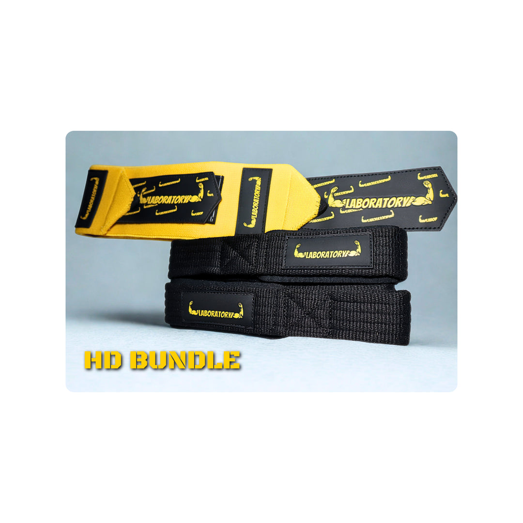  black HEAVY DUTY LABORATORY LIFTING straps AND YELLOW HEAVY DUTY WRIST WRAPS with 'LABORATORY' branding on a light blue background.