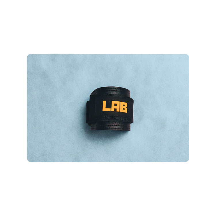 Black LABORATORY ANKLE STRAP with 'LAB' branding on a light blue background