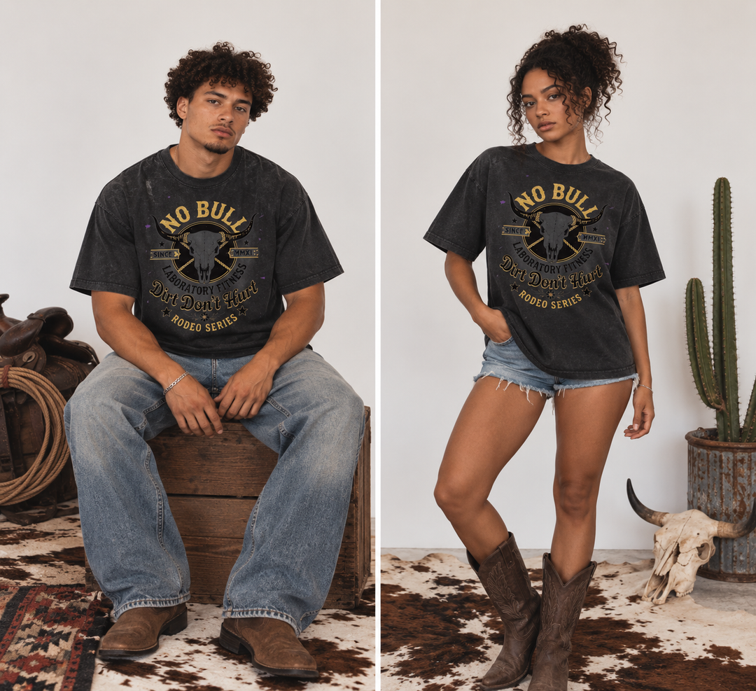 A split-screen lifestyle image showing a man and a woman wearing a dark charcoal graphic t-shirt with a western 'No Bull' design. The man is seated on a wooden barrel wearing blue jeans, and the woman stands wearing denim shorts and brown boots, set against a rustic white wall with a cactus and cowhide rug.