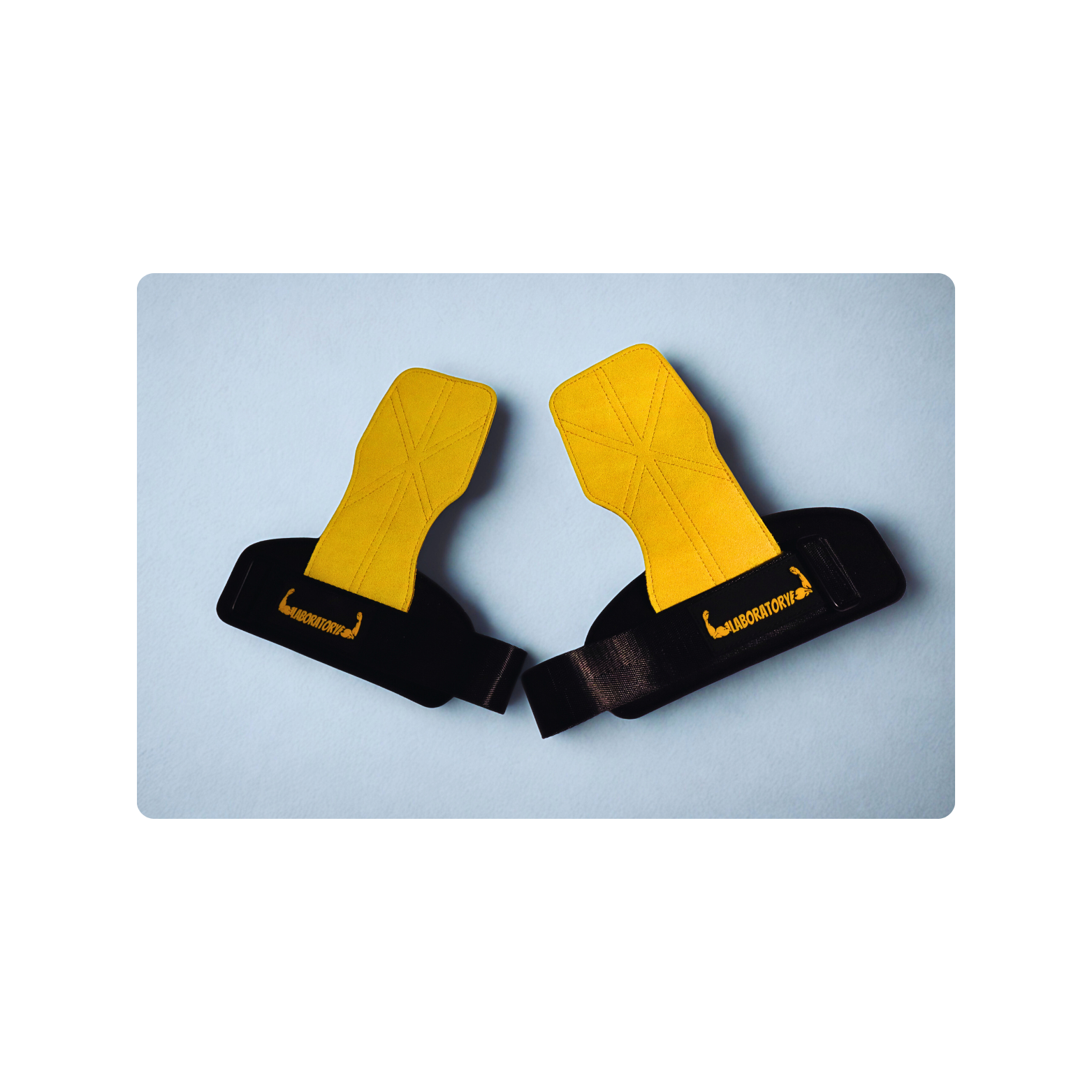 LABORATORY Pair of yellow and black GRIPS on a light blue background