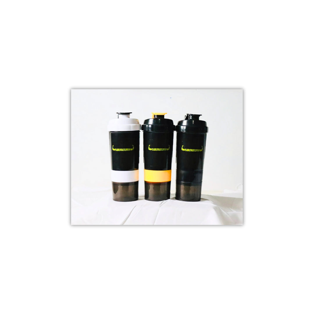 Three laboratory shaker bottles with a capacity of 500ml, featuring a white, black, and yellow color scheme with a yellow label on one. Each bottle has a built-in storage compartment at the bottom.