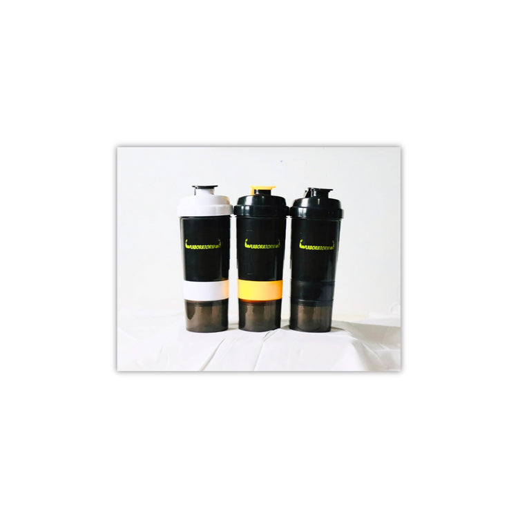 Three laboratory shaker bottles with a capacity of 500ml, featuring a white, black, and yellow color scheme with a yellow label on one. Each bottle has a built-in storage compartment at the bottom.