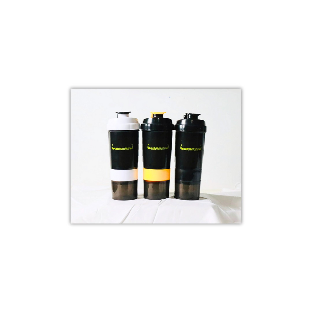 Three laboratory shaker bottles with a capacity of 500ml, featuring a white, black, and yellow color scheme with a yellow label on one. Each bottle has a built-in storage compartment at the bottom.