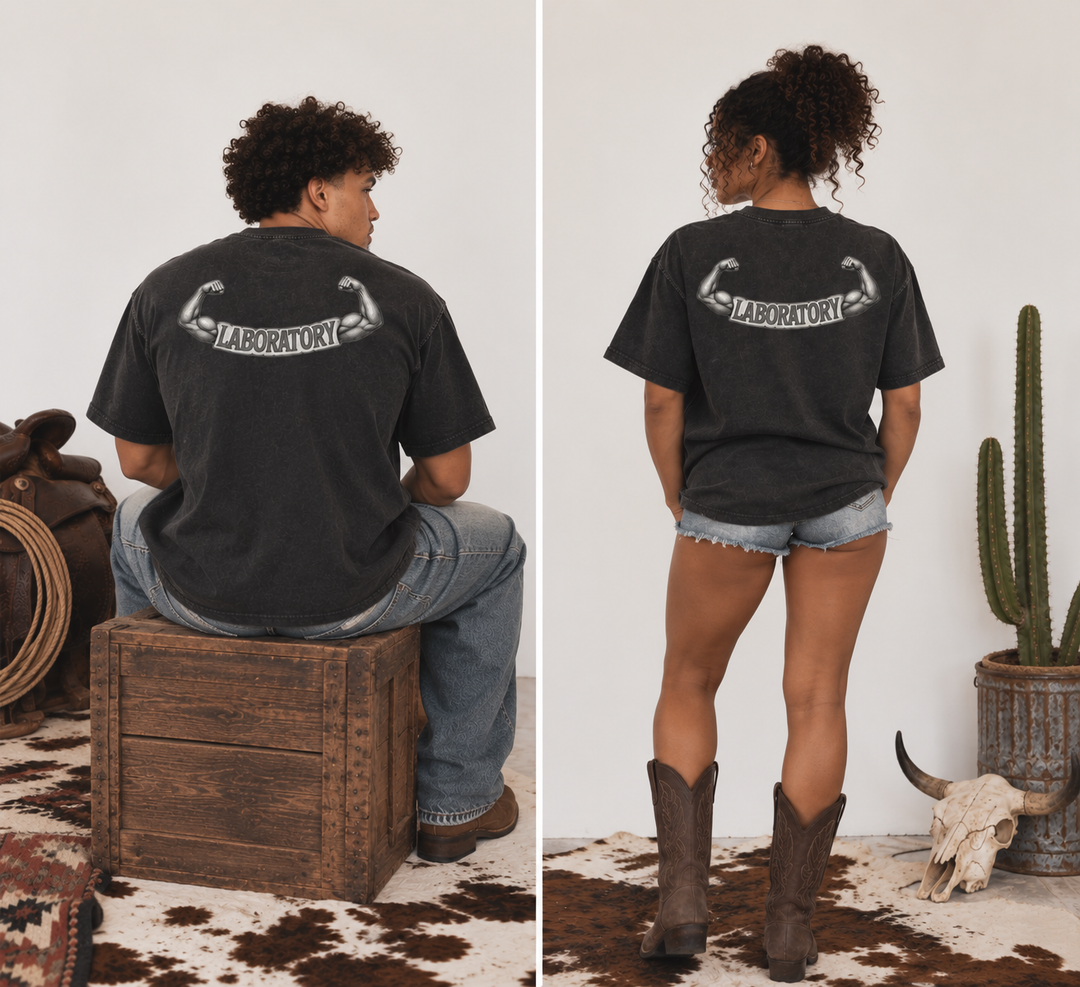 A split view showing a model from the back wearing a dark charcoal gray t-shirt with a white graphic that reads 'LABORATORY' with flexed biceps. The left panel shows the model sitting on a wooden crate, and the right panel shows them standing on a cowhide rug with denim shorts and brown cowboy boots.