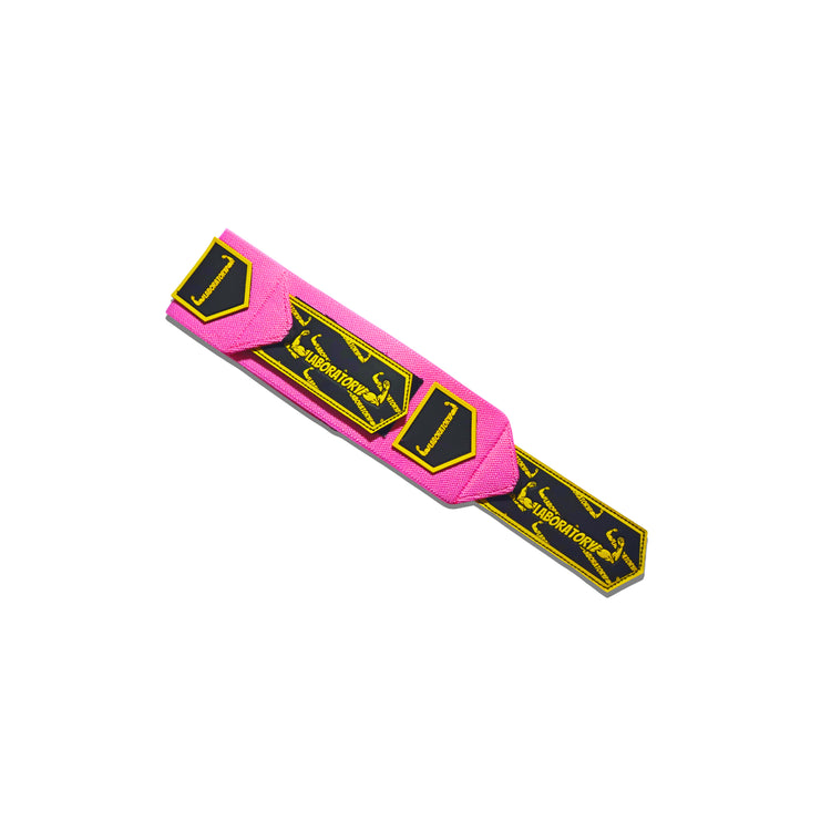Pink and yellow Wrist wrap with branding on a white background