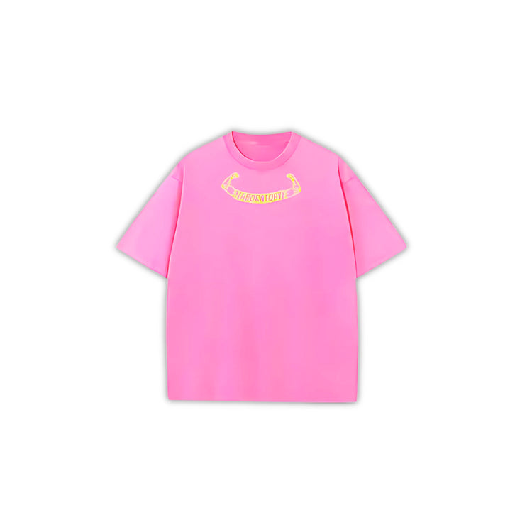 Pink oversized acid wash t-shirt with a yellow logo on the front.