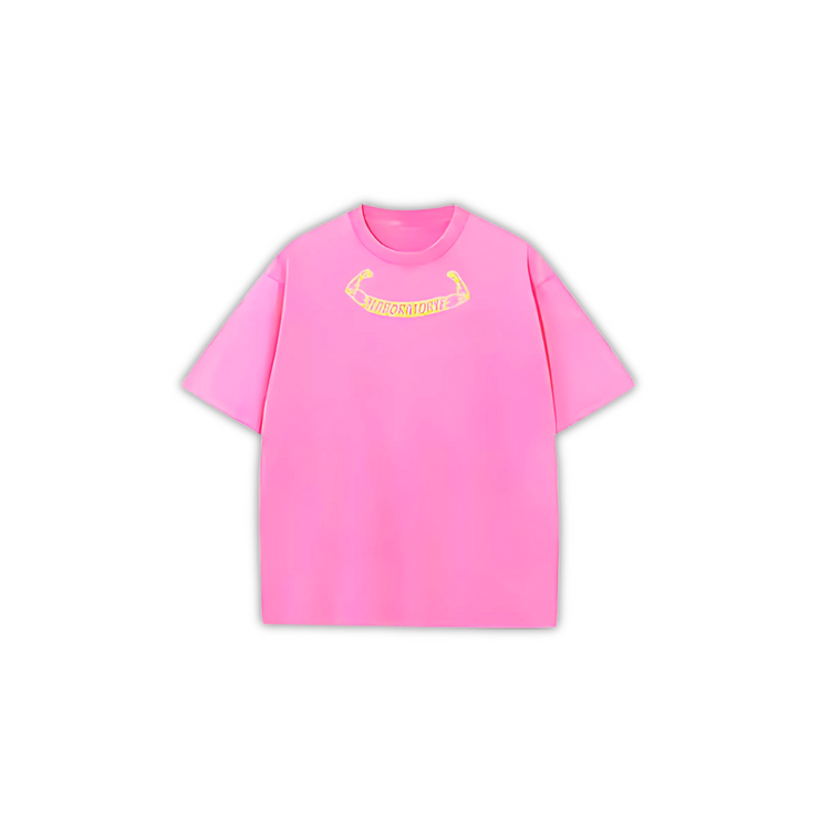 Pink oversized acid wash t-shirt with a yellow logo on the front.