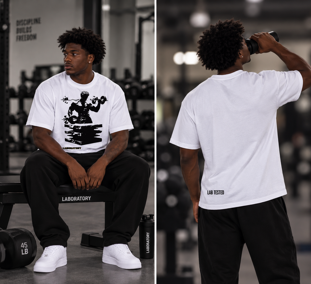 A split view of a man in a gym wearing a white graphic t-shirt with black print, black sweatpants, and white sneakers. The left panel shows him sitting on a bench facing left, and the right panel shows him from behind drinking from a bottle.