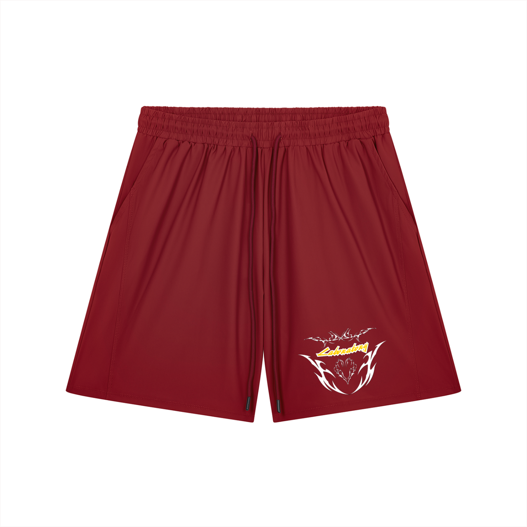 A pair of dark red athletic shorts with a drawstring waist and a stylized graphic logo on the lower left leg, displayed against a solid white background.